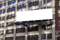 Big, horizontal, billboard on the building wall.