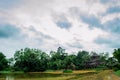 A big house in the garden beside pond and blue sky. Royalty Free Stock Photo