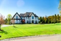 Big House suburb Single Family . Brick house with nice landscape and large green lawn Royalty Free Stock Photo