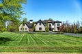 Big House suburb Single Family . Brick house with nice landscape and large green lawn Royalty Free Stock Photo