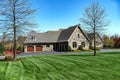 Big House suburb Single Family . Brick house with nice landscape and large green lawn Royalty Free Stock Photo