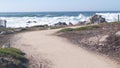 Big huge stormy sea waves crashing on rocky craggy beach, California ocean coast Royalty Free Stock Photo