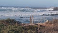 Big huge stormy sea waves crashing on rocky craggy beach, California ocean coast Royalty Free Stock Photo