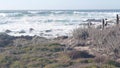 Big huge stormy sea waves crashing on rocky craggy beach, California ocean coast Royalty Free Stock Photo
