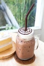 Big iced cocoa glass on wooden Royalty Free Stock Photo