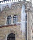 The big icicles under a house roof Royalty Free Stock Photo