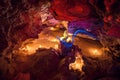 Big Illuminated crystal by candle light in cave. Mlynky Cave, Uk