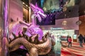 Big illuminated sculpture of colorful Chinese Dragon holding pearl in its claws in City of Dreams Macau resort