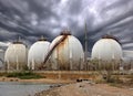 Big Industrial oil tanks in a refinery and Drainage system with Royalty Free Stock Photo