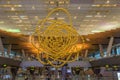 Big installation of golden pearl beads in ceiling in airport Hamad of Doha, Qatar
