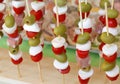 Big Italian skewers with olives, mozzarella cheese mortadella an