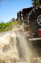 Big Jeep splashing mud in the mountains #3