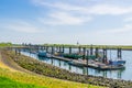 Big jetty with docked boats in the harbor of Tholen, Bergse diepsluis, oosterschelde, zeeland, The netherlands, 22 april, 2019