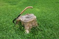 The big knife with long wooden handle on the tree stump Royalty Free Stock Photo