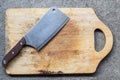 Big knife on rought wooden chopping block Royalty Free Stock Photo