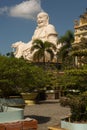 Big laughing sitting outdoor Buddha in Vinh Trang Pagoda in South Vietnam