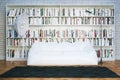 Big library shelves with many books in white living room Royalty Free Stock Photo