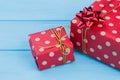Big and little red dotted gift boxes. Royalty Free Stock Photo