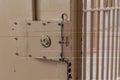 Big lock on prison door with bars Royalty Free Stock Photo