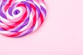 Big lollipop on solid pink background