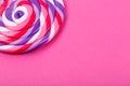 Big lollipop on solid pink background