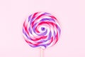 Big lollipop on solid pink background