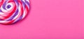 Big lollipop on solid pink background