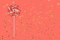 Big lollipop on solid pink background . Living coral theme - color of the year 2019