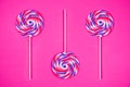 Big lollipops on solid pink background Royalty Free Stock Photo