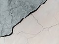 Big long winding ascending crack on old plastering and painted wall. Copy space. Royalty Free Stock Photo