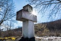 Divine Illumination: White Marble Cross at Sunset