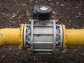 Close up shot big valve on a thick yellow gas oil water pipeline tube Royalty Free Stock Photo