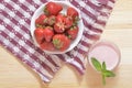 Big mature strawberries on a white plate