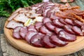 Big meat set. Homemade smoked pork-beef sausage, salted bacon, basturma chopped slices Royalty Free Stock Photo