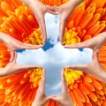 Big Medical Cross symbol from hands isolated Royalty Free Stock Photo