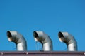 Big metal chimneys on a roof Royalty Free Stock Photo