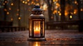 Big metal lantern with a burning candle inside, outdoors on the wooden ground