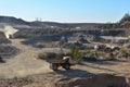 Big mining truck transportion sand in the open-pit. Heavy machinery in the mining quarry, excavators, dozers and trucks. Digging