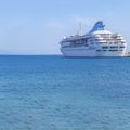 Big modern luxury cruise ship docked at marina dock with sea