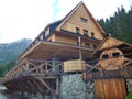 Big mountain hut with terrace and wooden facade