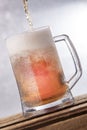 Big mug Beer Over flow Royalty Free Stock Photo