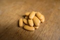 Big multivitamin dietary supplement tablets on wood