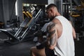 Huge muscular man training at bodybuilding gym Royalty Free Stock Photo