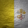 big national flag of vatican city on a grunge old paper texture background Royalty Free Stock Photo