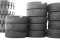 Big new tires for trucks. Black tires are in a row. Isolated background Royalty Free Stock Photo