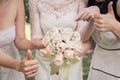 Big nice wedding bouquet in woman`s hands. Bride and bridesmaids show sign OK and thumbs up Royalty Free Stock Photo