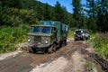 Big off-road truck pulls pross small SUV. Royalty Free Stock Photo