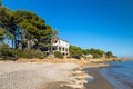 old abandoned house with pool on the beach overgrown with palm trees and plants, lost places, tarragona spain Royalty Free Stock Photo