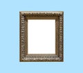 Big old antique golden frame isolated on blue background Royalty Free Stock Photo