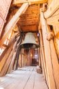 A big old bell hanging in a wooden church`s old tower Royalty Free Stock Photo